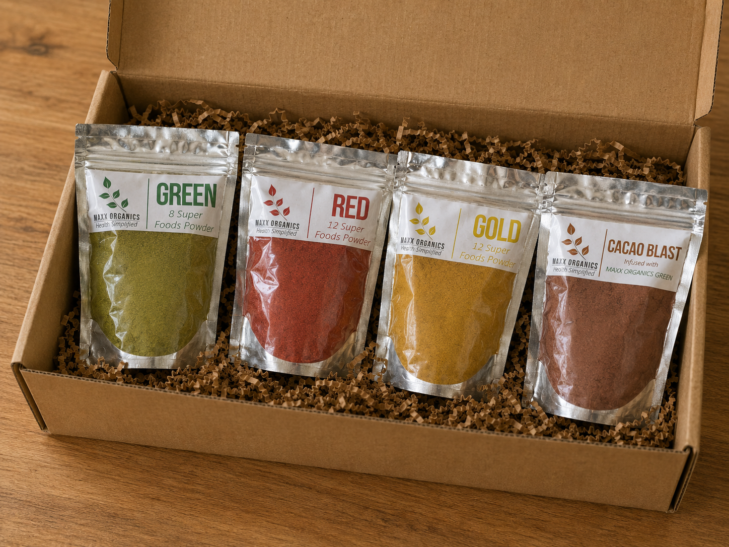 MAXX Organics Favorable Four: GREEN, RED, GOLD, and CACAO BLAST pouches in a gift box